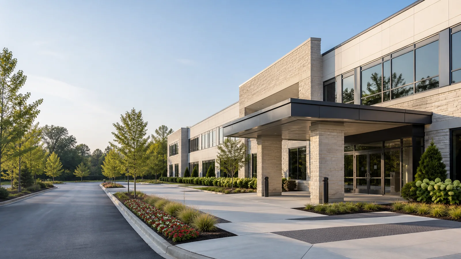 Modern commercial facility with a clean entrance and landscaped grounds